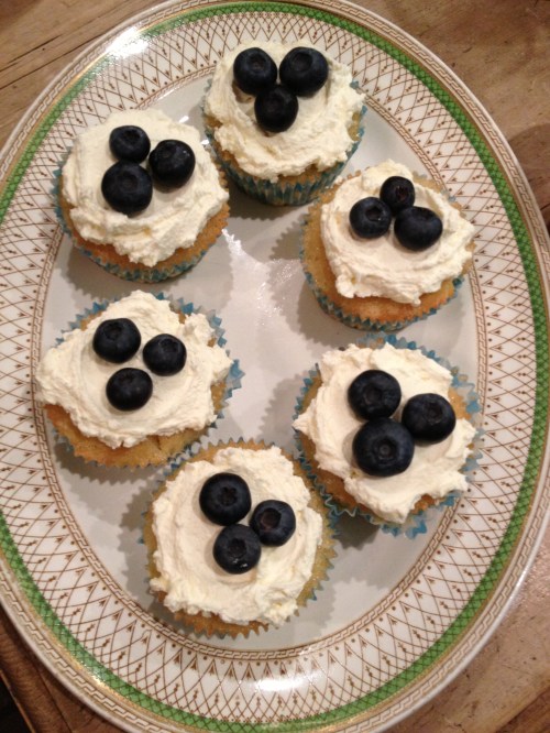 Lemon drizzle cupcakes with lemon curd cream and blueberries